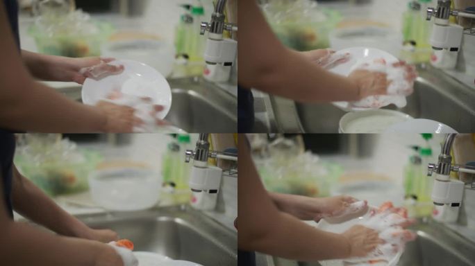 手女人用手洗碗洗洁精去油去污油渍洗盘子