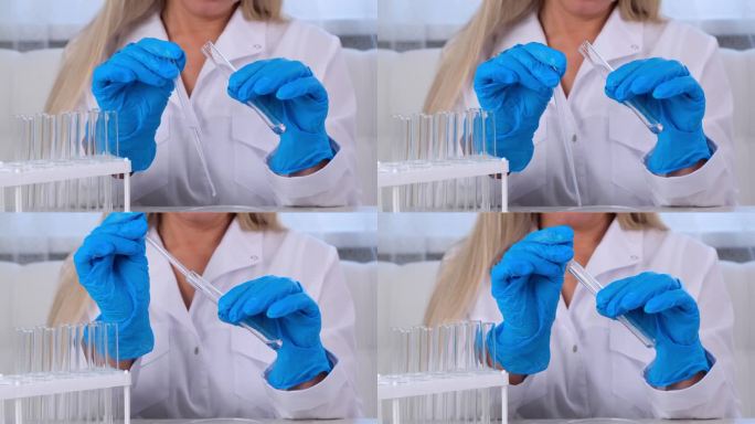 专业科学家为医学实验采集样本。研究化学家在实验室里用微移液管和显微镜工作