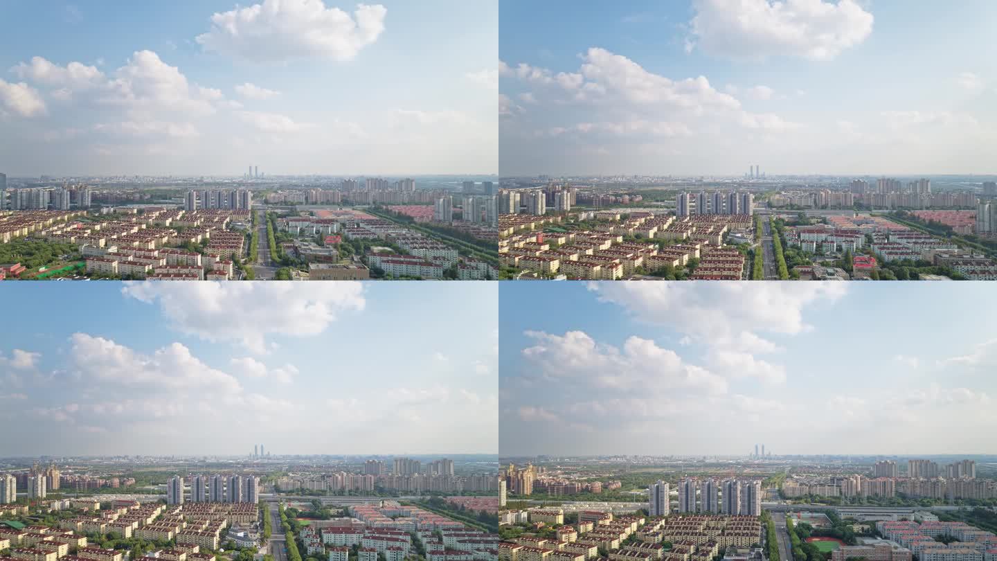 上海城市在晴朗多云天的高角度视图，4k延时镜头航拍无人机视图。