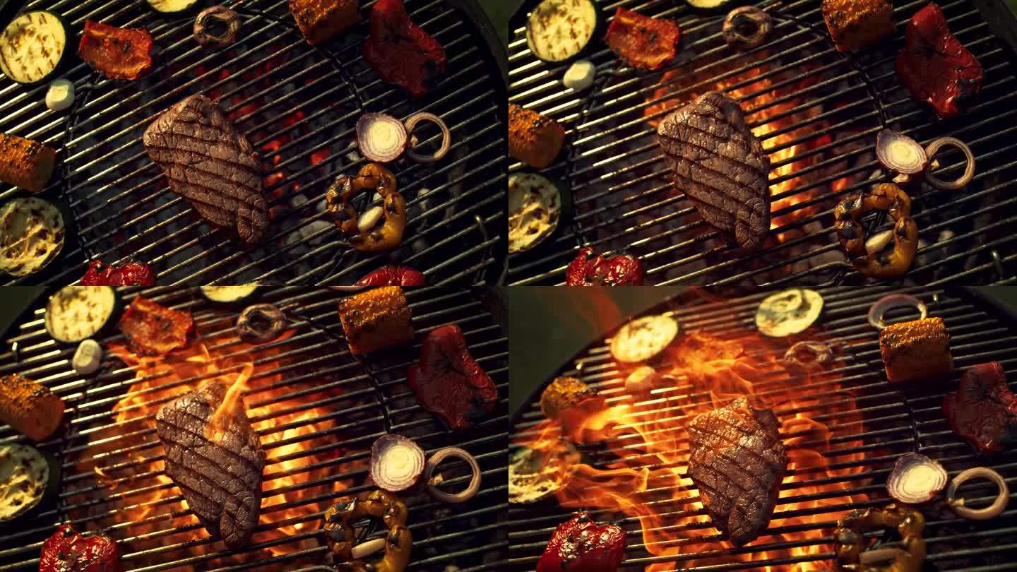 美味的牛排和烤蔬菜在户外的火焰烹饪。在室外烧烤架上准备烤肉。电影超级慢动作镜头与速度斜坡效果