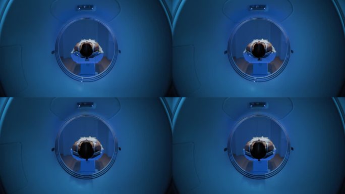 在医学实验室，一个匿名的女性病人躺在CT或MRI扫描床上的镜头进行扫描程序。检查开始时，床向相机移动
