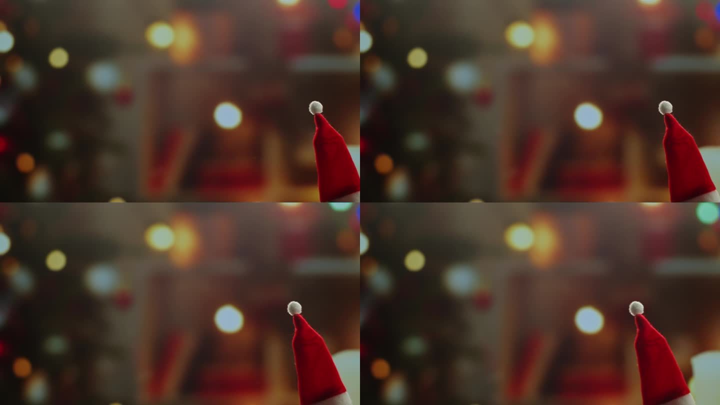 背景特写上的小圣诞帽。小精灵，小矮人，戴着红帽子，走在家里的圣诞树旁。冬季假期的氛围，2024年，2