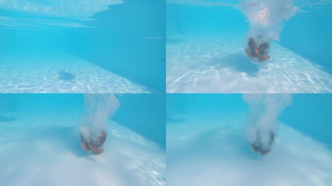 水下镜头:不知名的男性跳入游泳池并坐在池底。一个男人在炎热的夏日享受茶水，在温泉或酒店游泳的跟踪镜头