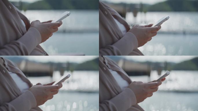 女性使用智能手机女子玩手机看手机微信聊天