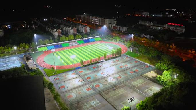 航拍重庆高校运动场夜跑运动