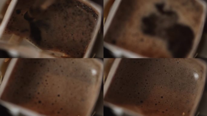 超慢速视频:微距镜头的热水倒进一个滴漏咖啡包