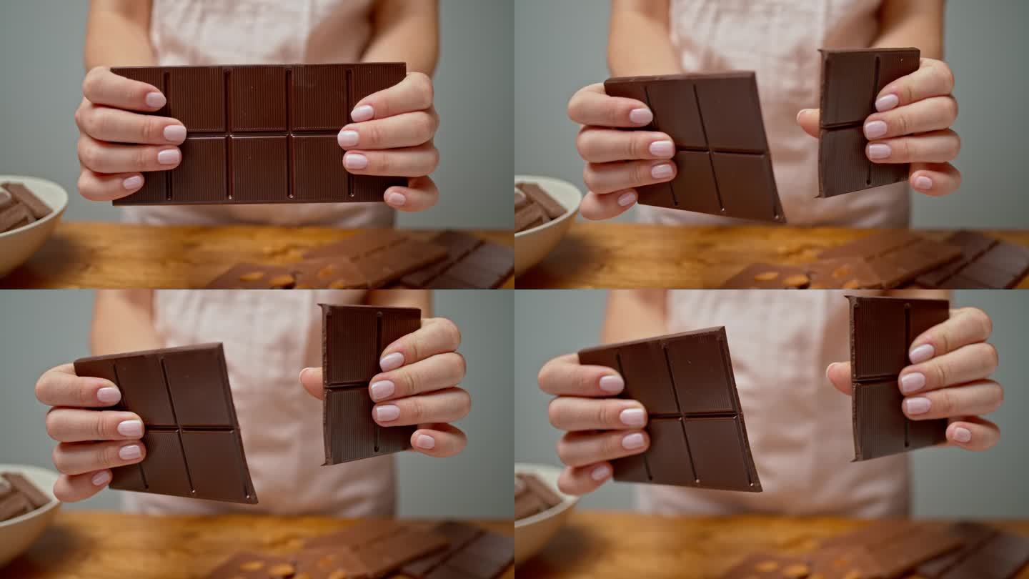女性的手在掰巧克力棒
