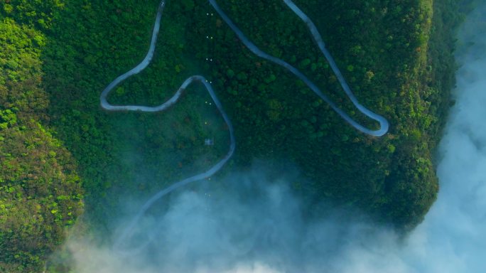 航拍清晨云雾云海山区公路