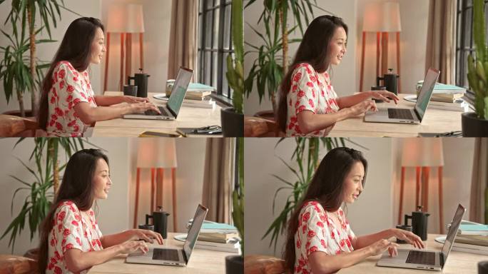 家庭办公室里在笔记本电脑键盘上打字的女人特写。员工通过无线设备上网工作。可爱的女士享受在网络文档中书