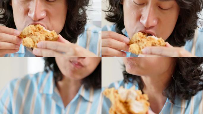 男人吃炸鸡美食享受轻松用餐油炸美食
