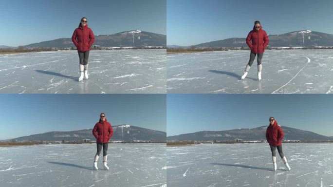在一个阳光明媚的冬日，微笑的年轻女士在结冰的湖面上滑冰