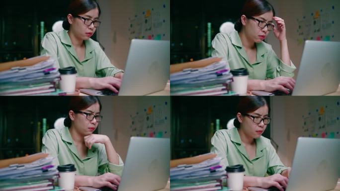 亚洲女性使用笔记本电脑工作到深夜