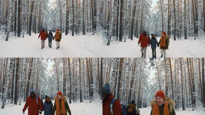 妈妈、爸爸和儿子走在大森林里的雪路上