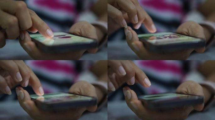 女人在智能手机上触摸手指的特写