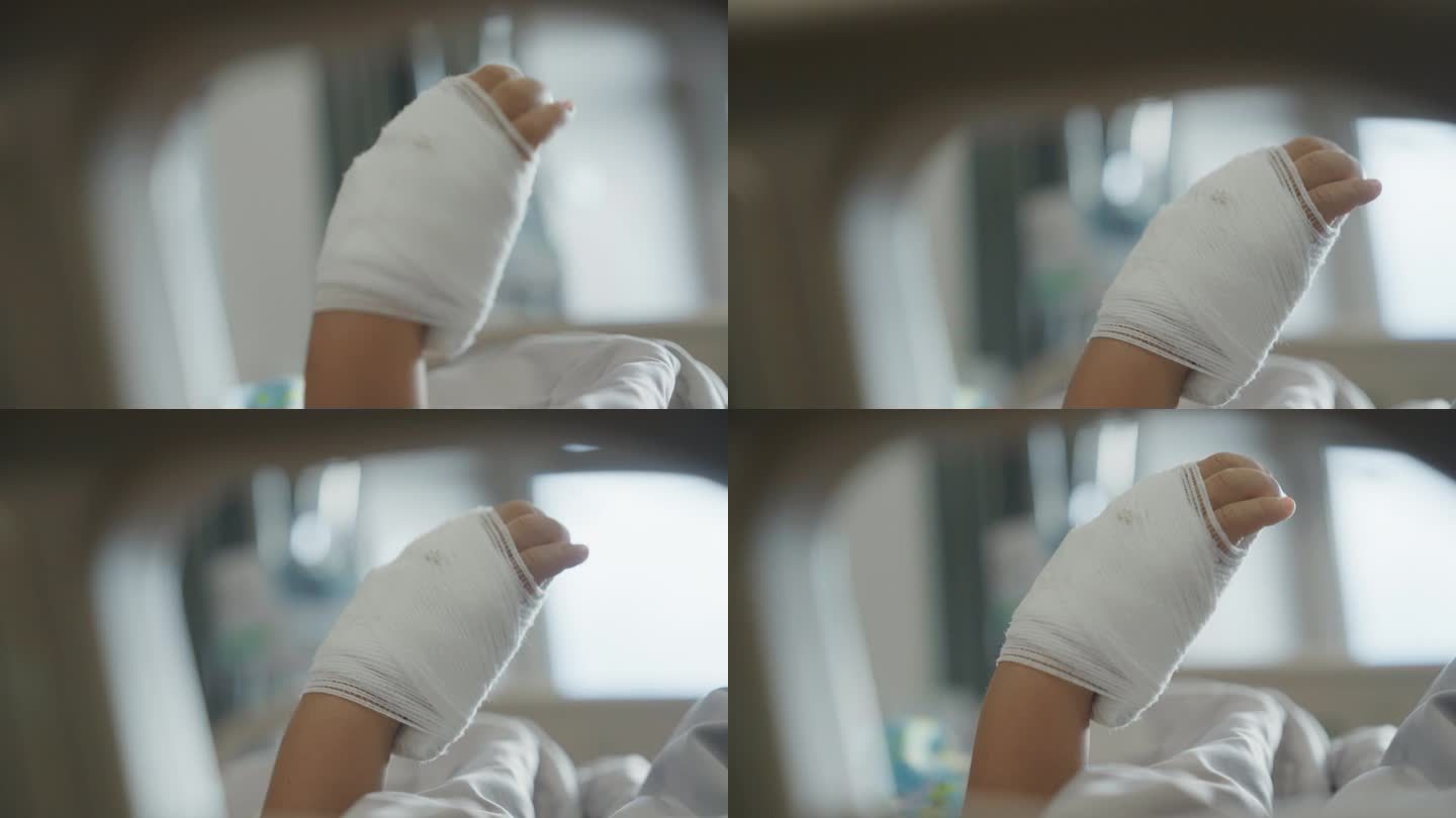一个小男孩的手与输液的特写，孩子的病人生病住院。