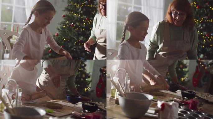 一位老妇人和她的孙女在圣诞节期间一起烘焙的慢动作肖像。奶奶教小女孩如何做姜饼饼干。孩子在假期帮忙做饭