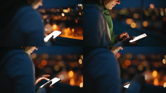 夜间在城市屋顶上使用智能手机的女子特写