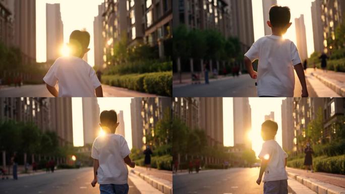 快乐的男孩在城市人行道上奔向阳光