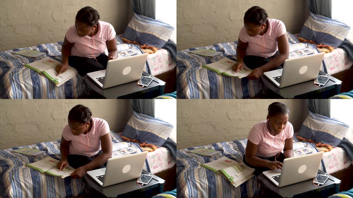 非洲农村教育。年轻的非洲黑人女孩在卧室里做家庭教育