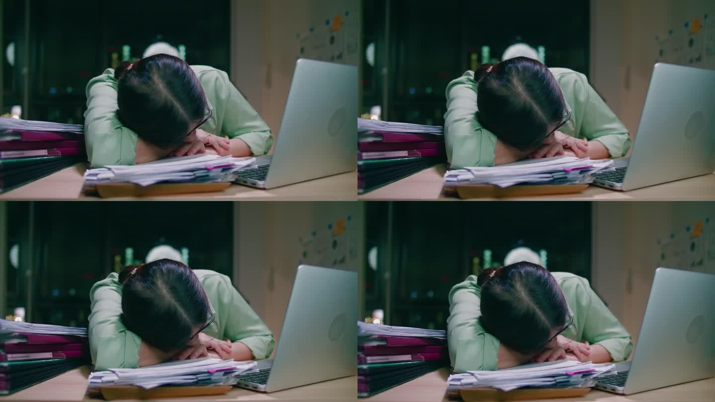 亚洲女性使用笔记本电脑工作到深夜