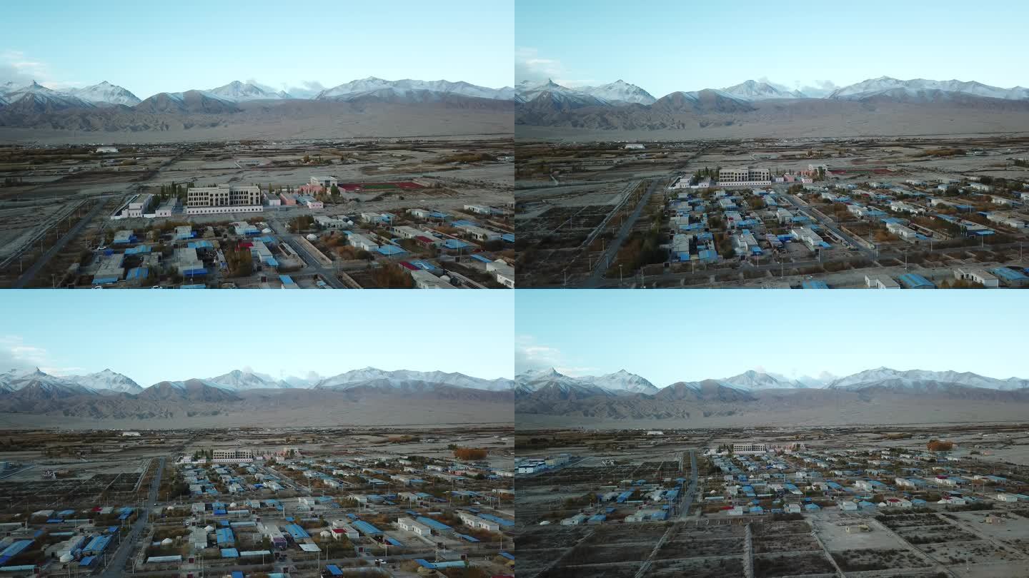 新疆航拍塔县农村冰山脚下帕米尔高原