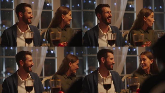 一对可爱的高加索夫妇享受节日大餐的肖像，在桌子周围分享食物，并进行有趣的对话。快乐的男人和女人在家里