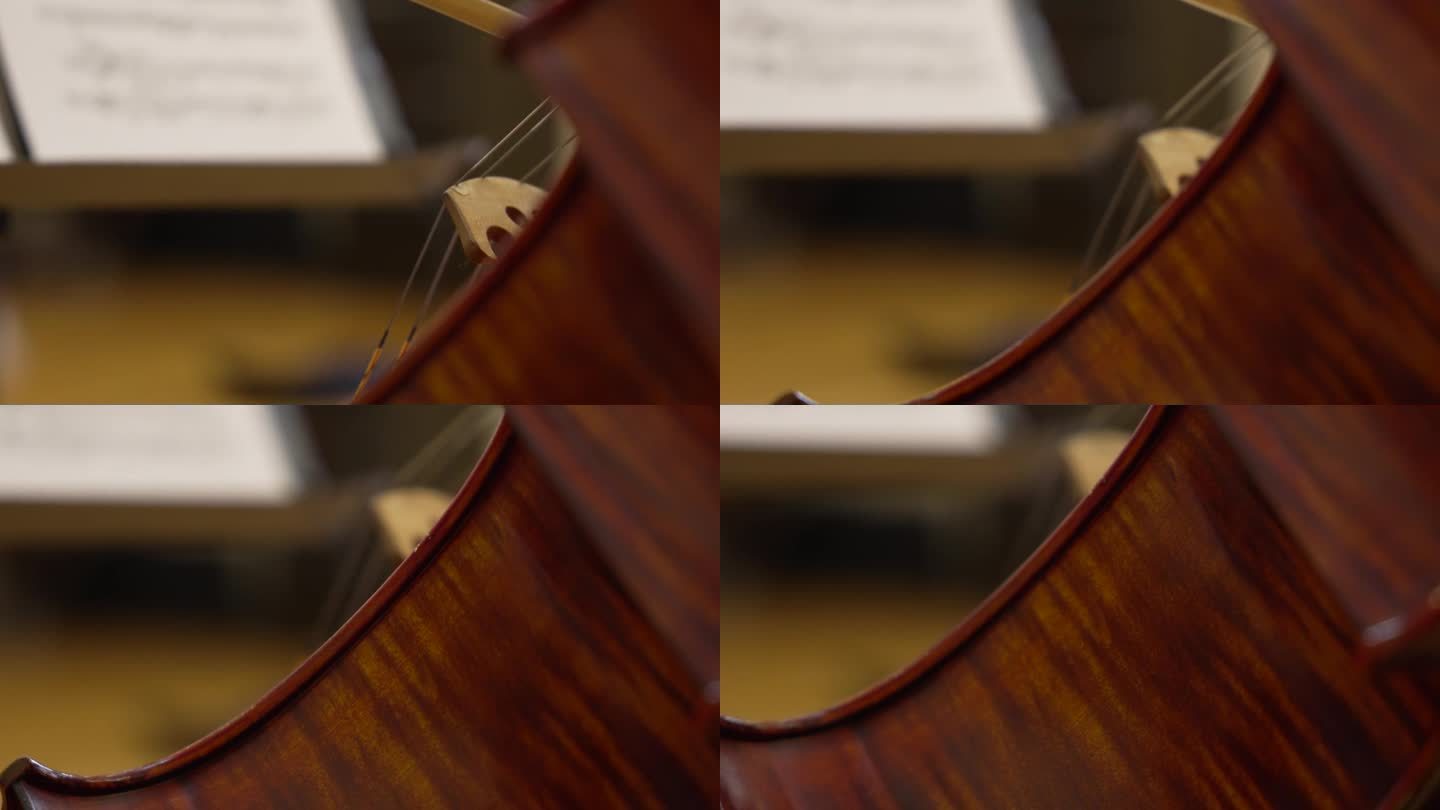 棕色大提琴的细节特写，以法国弓优雅地放在上面为特色。