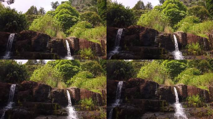 在夏威夷考艾岛风景秀丽的威美亚峡谷，万向节轰隆隆落下的瀑布。4 k