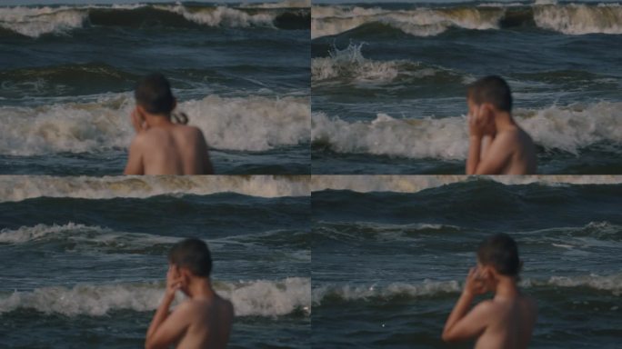 男孩看着大海很危险