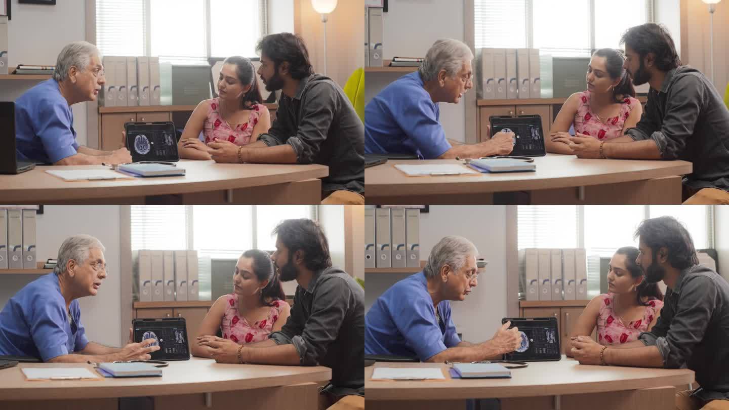 印度夫妇在私人诊所看医生:专业医生使用数字平板电脑向患者解释核磁共振成像结果，回答问题，建议最佳医疗