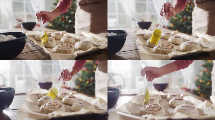 慢动作特写的手，一个匿名的女性制作糕点与家人和朋友分享圣诞节。为节日晚上的客人准备美味的面包