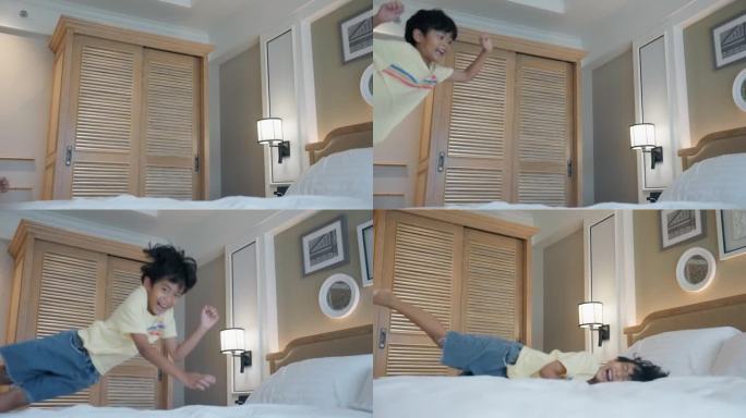 快乐的孩子们在酒店房间的床上奔跑