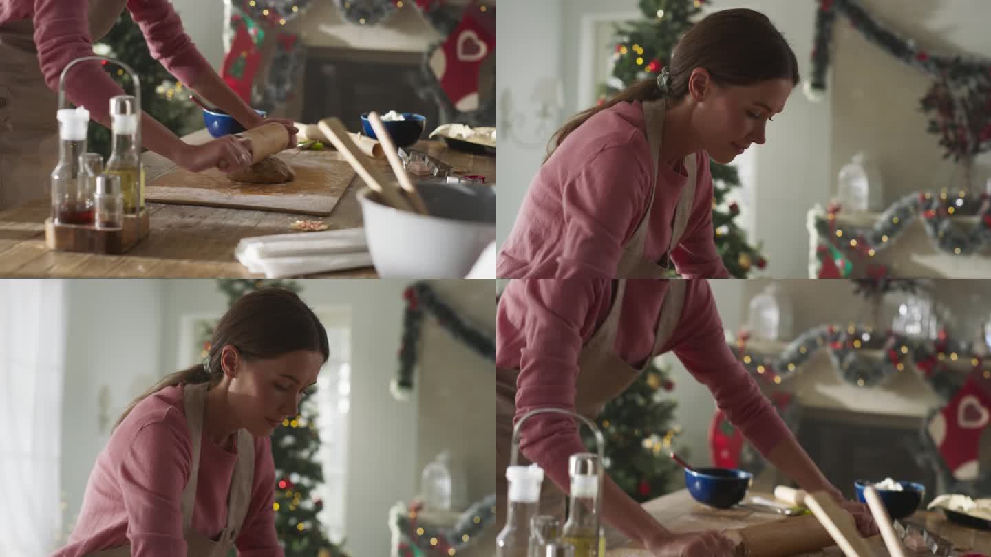 一个美丽的女人准备饼干面团为节日做姜饼的电影镜头。慈爱的母亲为她的家人准备圣诞和新年的糕点