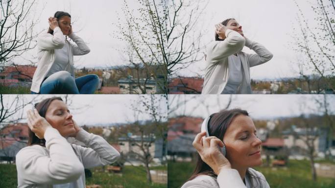 一个女人戴着耳机在城市公园里听音乐