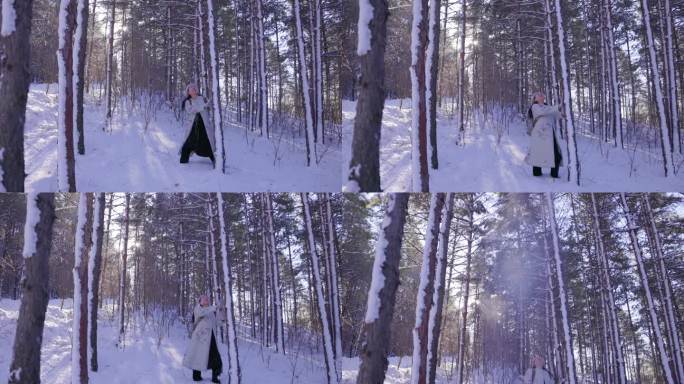 冬季户外雪中树林里的女性