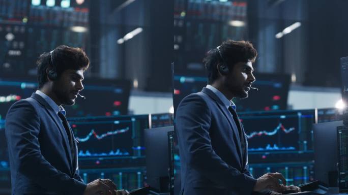 垂直屏幕:金融分析师使用具有多显示器工作站的计算机，具有图形，财务报告和市场图表。在现代证券交易企业