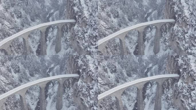 空中Landwasser高架桥冰川和伯尔尼纳在冬季下雪。