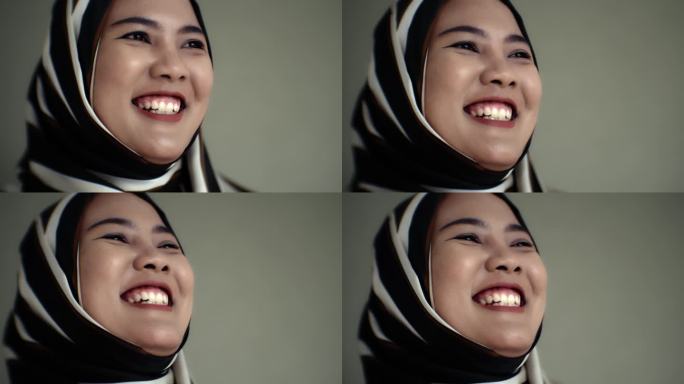 微笑的亚洲穆斯林妇女
