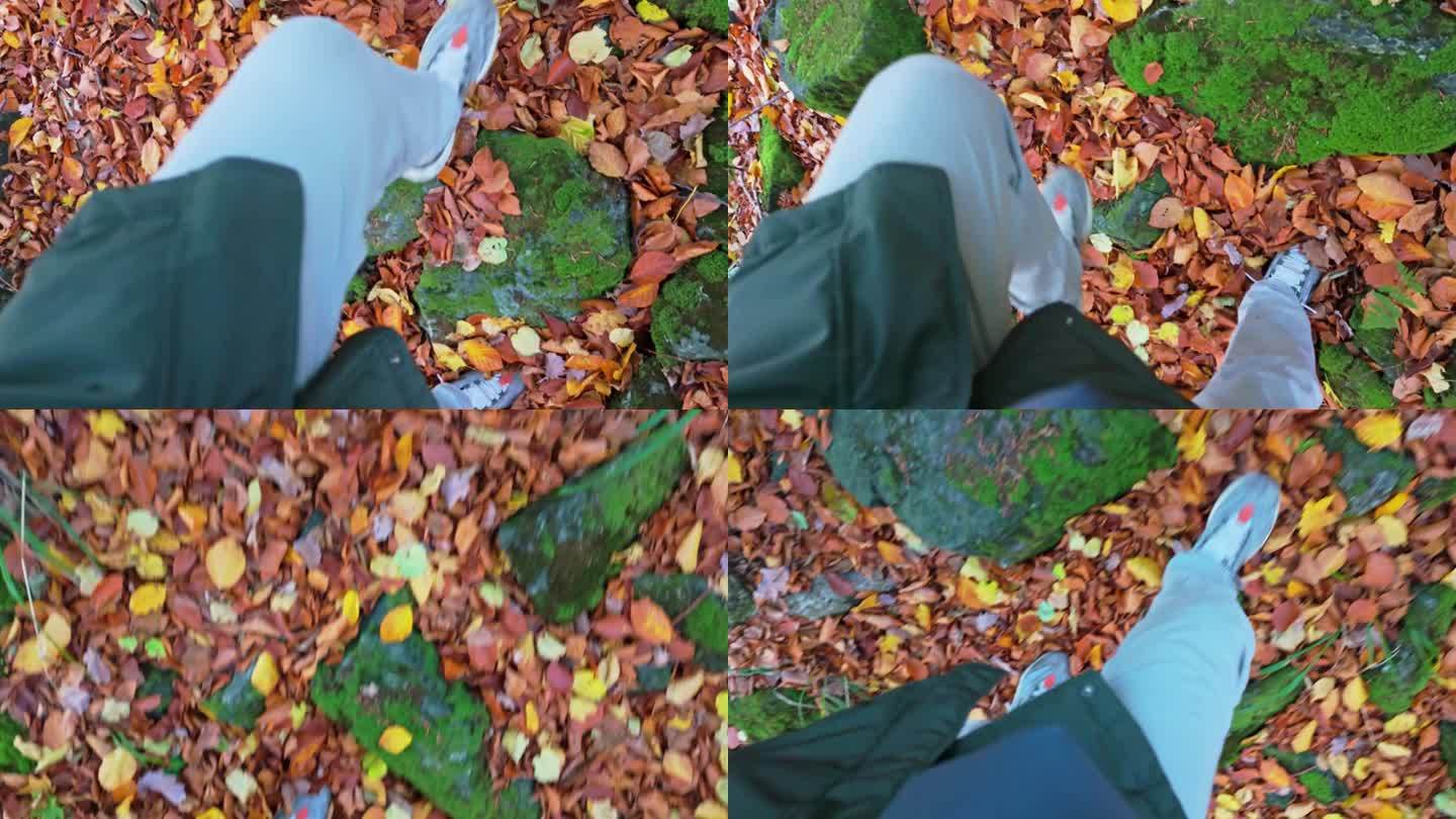 靴子在秋叶间徘徊，踩过岩石和折断的树枝，暗示着一个迷路的徒步旅行者的旅程。