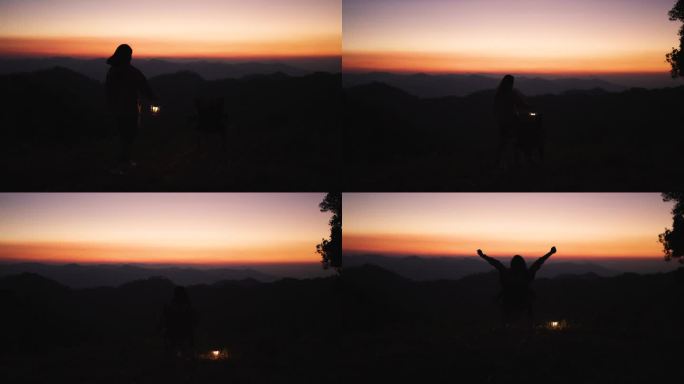 徒步女呆在山上，在日出的时候拍照，有一个快乐的时间