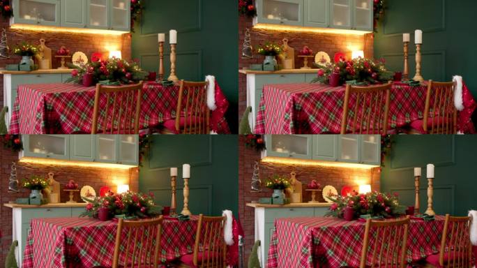 圣诞节的红色装饰，在一个时尚的现代和舒适的厨房在家里。圣诞节，在家里度过美妙的夜晚。圣诞快乐，新年快