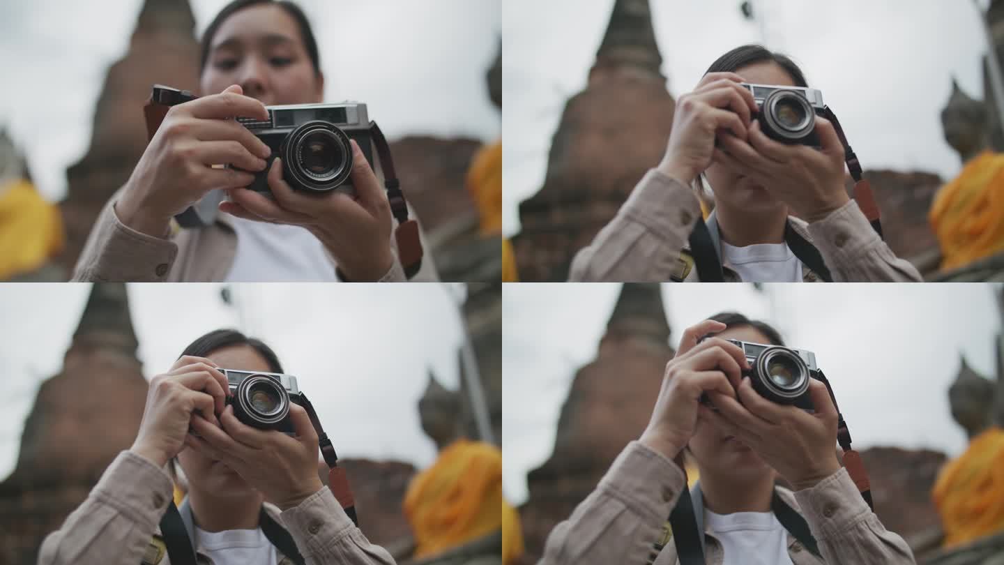 亚洲女游客正在拍照