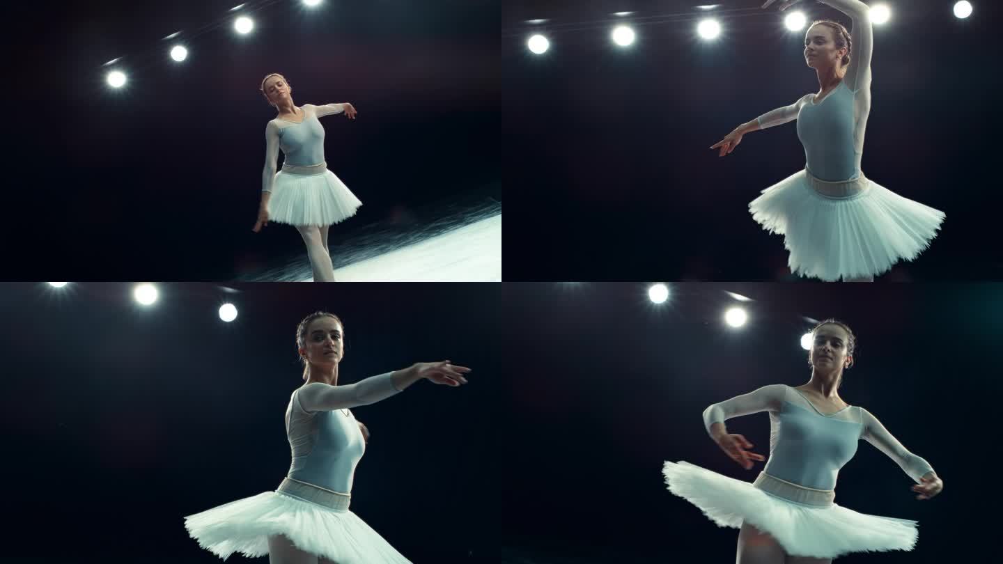 优雅的芭蕾舞女演员在黑暗的灯光舞台上跳舞。女青年练习穿漂亮衣服、做脚尖旋转和脚尖旋转。电影超级慢动作