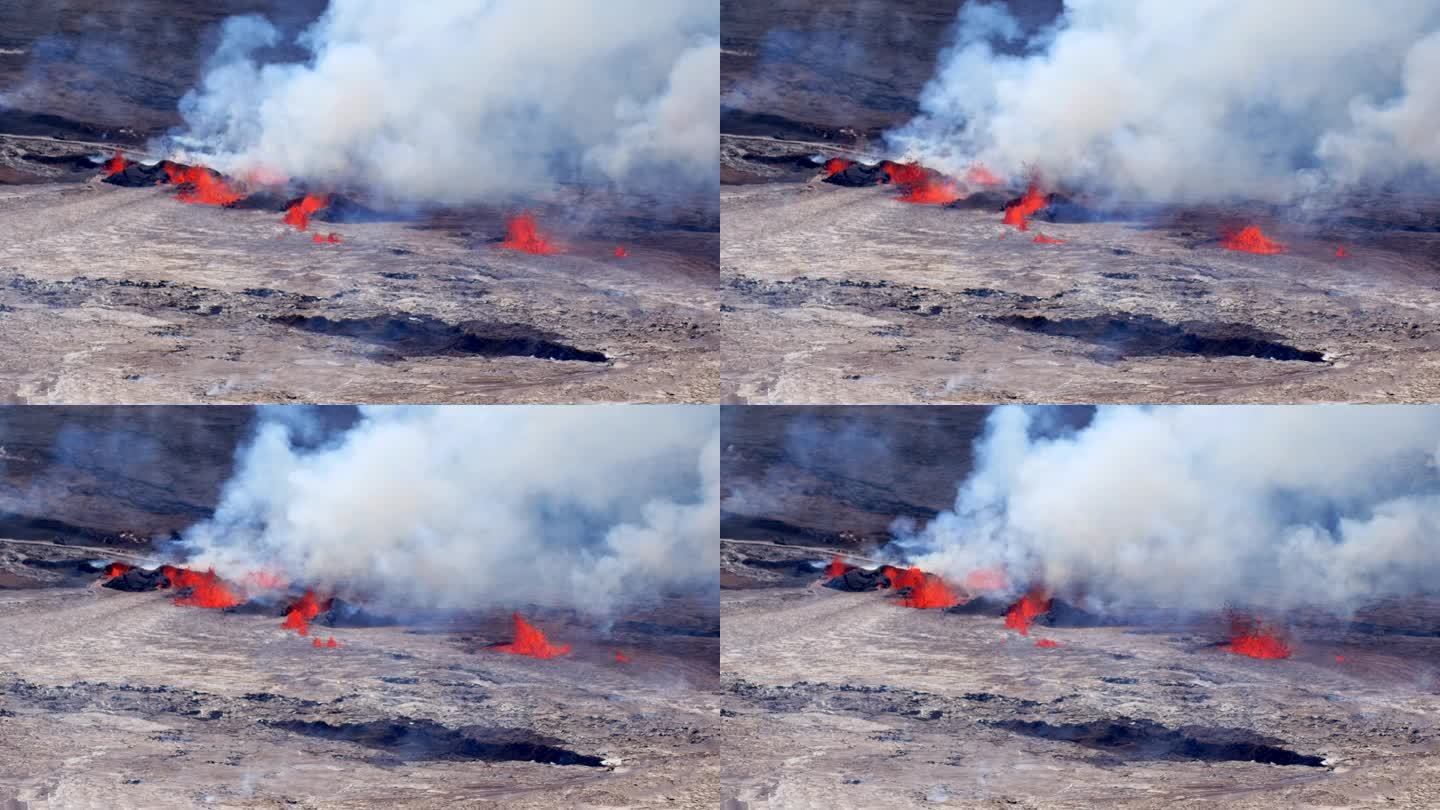 9月11日，基拉韦厄火山口喷发。从东面看，火山喷发第二天，冷却的熔岩湖上有地壳，几个喷泉呈裂缝状。