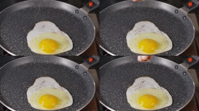 用不粘锅煎蛋，在单面煎蛋上撒上黑胡椒粉