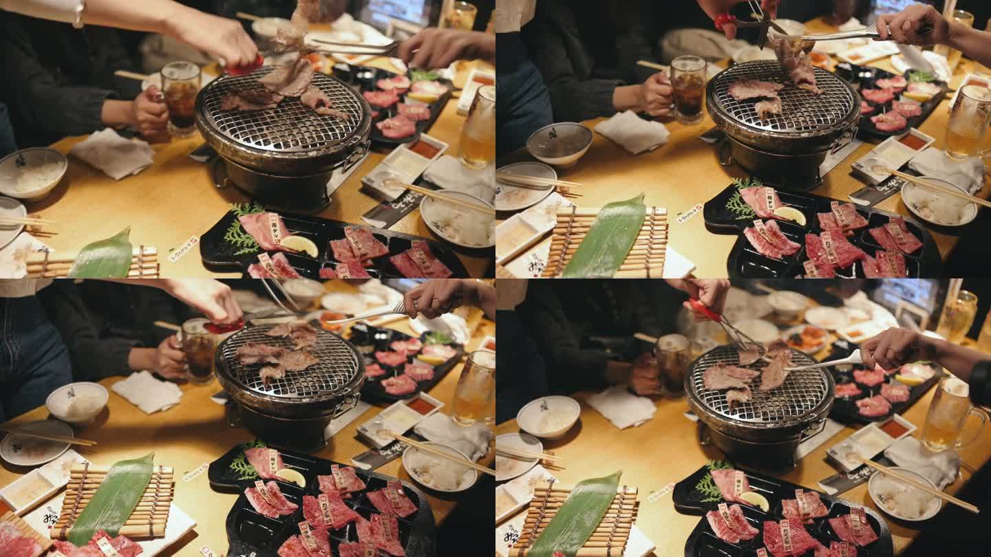 在日本的一家餐馆里，一群妇女正在吃传统的日式牛肉烤肉烧肉和牛肉