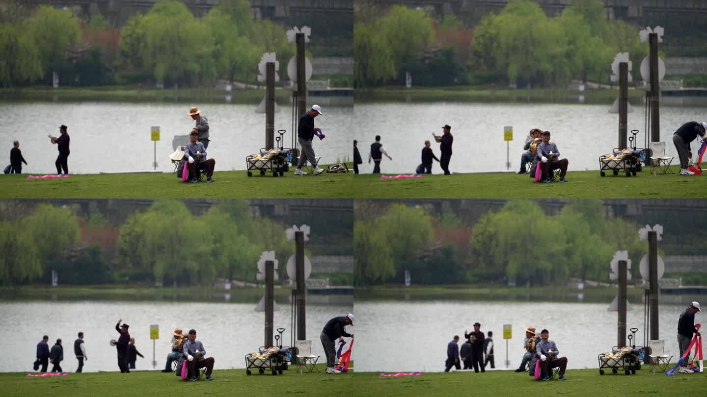 湖边放风筝的人们