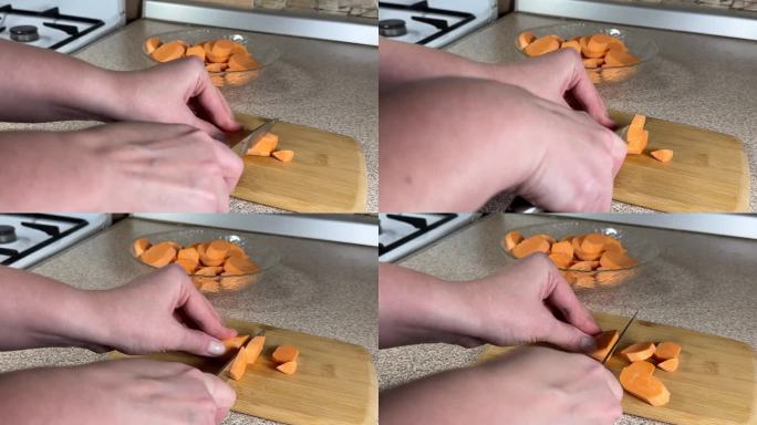 一名妇女用菜刀在木板上切红薯，木板对着镜头