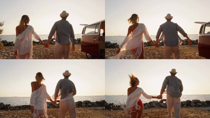 跟踪的男人和女人在爱跑在沙滩上与小型货车公路旅行。新婚夫妇在美丽的小岛上度蜜月，享受夏日的慢动作