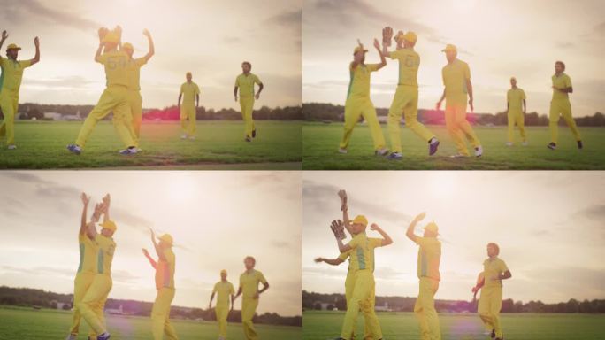 穿着黄色制服的印度职业板球队庆祝轻松战胜对手。鲍勒和其他球员互相击掌欢呼。温暖的傍晚天气和美丽的日落